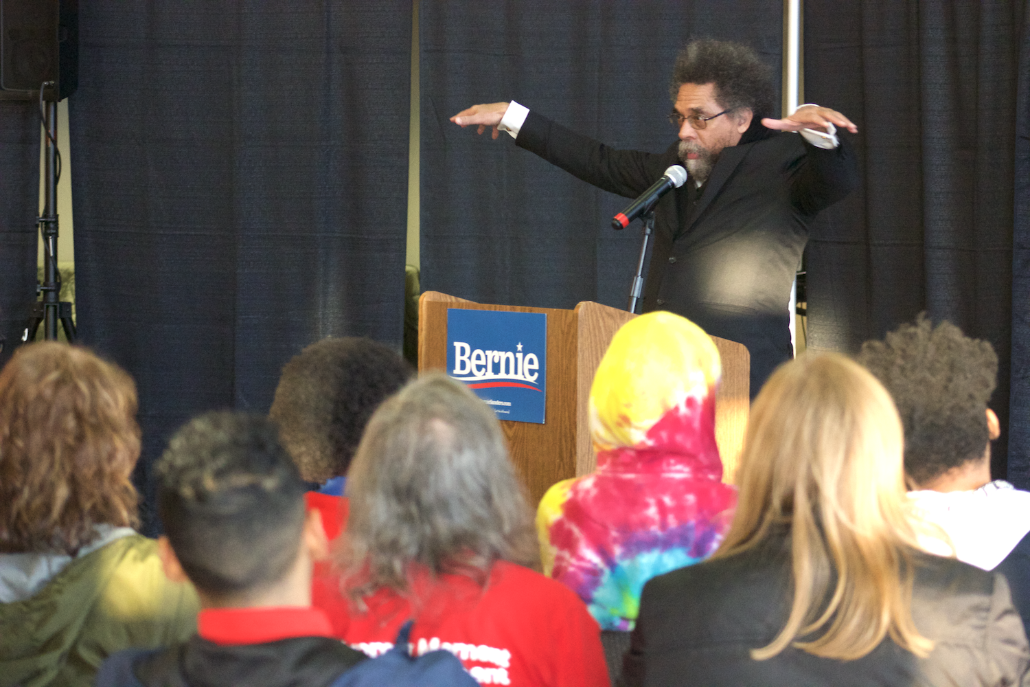 Political activist Dr. Cornel West speaking to event goers at a Bernie Sanders' Town Hall on Tuesday.